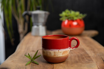 coffee cups with mocha pot on a wooden table