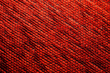  texture of a knitted woolen fabric red. Background