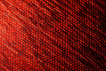  texture of a knitted woolen fabric red. Background