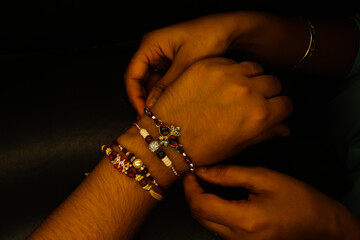 Sister tying rakhi thread on brother's hand Raksha Bandhan special brother-sister love bond
