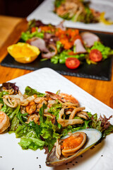 Mussel, shrimp and squid salad. Close-up, selective focus