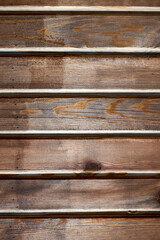 Naklejka premium Old rustic brown wooden plank background. Seamless texture.