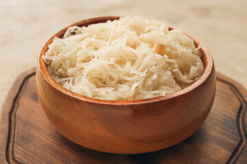 Bowl with tasty sauerkraut on table, closeup