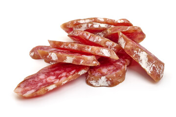 Spanish Fuet sausage slices, isolated on white background. High resolution image.