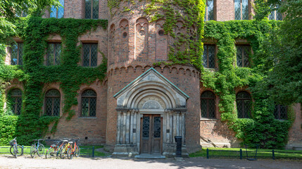 Medieval building Kings house overgrown in the park Lundagard in city central Lund, Sweden
