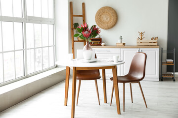 Protea flowers in interior of modern kitchen
