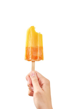 Woman Holds Bitten Yellow Ice Cream On White Background Isolated. Color Frozen Fruit Popsicle.