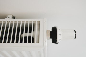 Heat radiator knob. Adjusting temperature on heating radiator