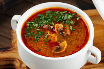 Closeup on portion of red mushroom soup