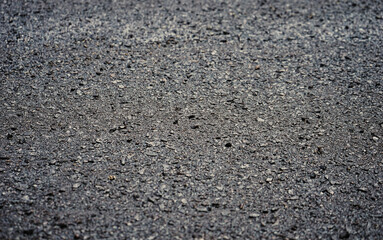 New asphalt road background with selective focus