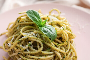 Plate with tasty pesto pasta, closeup