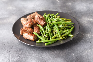 Fried pea pods and Turkish meat cutlets.