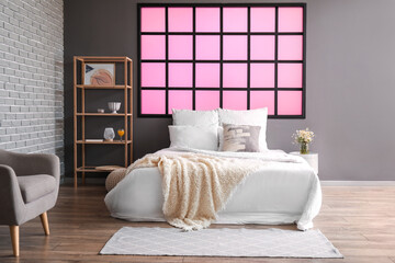 Fototapeta na wymiar Stylish interior of modern bedroom