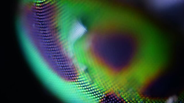 Macro sharp and detailed fly compound eye surface under microscope. 100x magnification.  The faceted structure of the eyes of flies and insects. The stunning beauty of the microcosm.