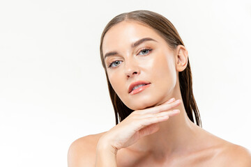 Beautiful Caucasian woman with clean glowing face skin in isolated studio white background for...