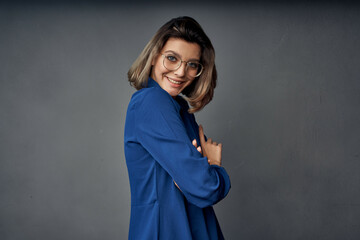 woman in blue shirt wearing glasses posing Glamor fashion