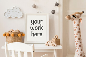 Stylish scandi child room with mock up photo frame, plush giraffe, wooden toys, boxes, blocks, wall...