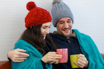 Romantic concept shot of caucasian lover couple in wool sweater jacket knitted hat cover and wrap...