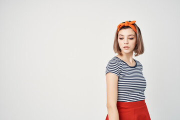 emotional woman in striped t-shirt modern style posing glamor