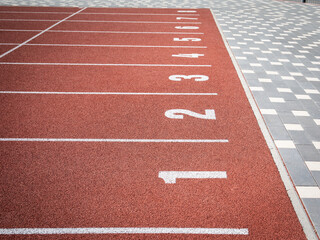 Starting position. Red running track in stadium