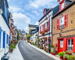 Saint-Valery-sur-Somme, France, August 15, 2020 - Beautiful flowered traditional street...