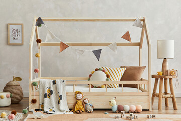 Fototapeta na wymiar Stylish composition of cozy scandi child's room interior with wooden bed, pillows, elegant lamp, plush and wooden toys and textile hanging decorations. Creative wall, carpet on the floor. Template.