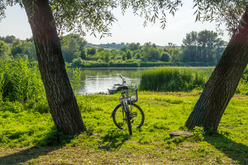 Fototapeta na wymiar Bike on the river bank