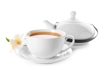 Cup of jasmine tea and teapot on white background