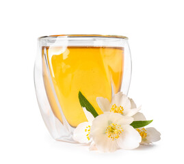 Fototapeta na wymiar Glass of jasmine tea and flowers on white background