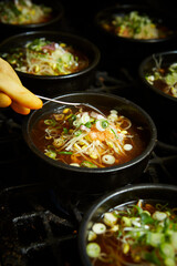 Add chilli powder to the cooking pot