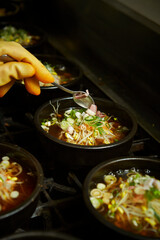 Add chilli powder to the cooking pot