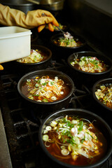 Add chilli powder to the cooking pot