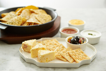 Cheese, crackers and nacho chips 
