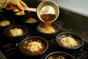 Add broth to boiling pot