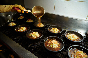 Add broth to boiling pot