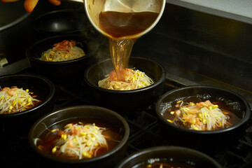Add broth to boiling pot