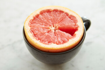 Sliced grapefruit tea on marble background