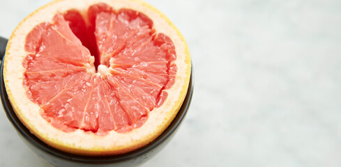 Sliced grapefruit tea on marble background