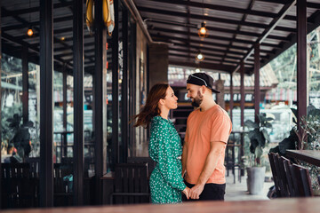 Beauty couple drinking coffee on cafe hipster style, beard man, woman in the dress, happy face, love romantic