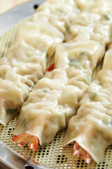 Whole shrimp dumplings in a steamer