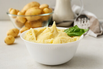 Bowl with tasty mashed potatoes on table