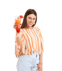 Beautiful young woman with cocktail on white background