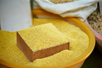 Yellow grains displayed in a traditional market