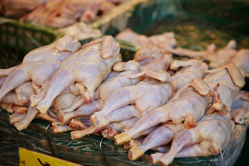 Raw chickens on display in a traditional market