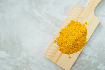  yellow powder on a cutting board