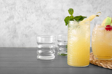 Glass of delicious mai tai cocktail on color background