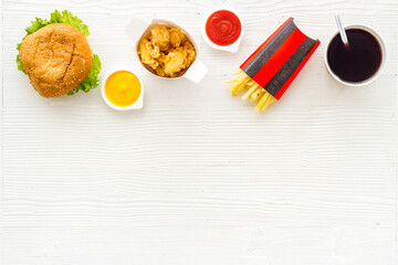 Layout of junk food - french fries burger and chicken nuggets