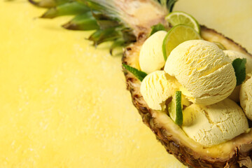 Tasty pineapple with ice cream and lime on color background, closeup
