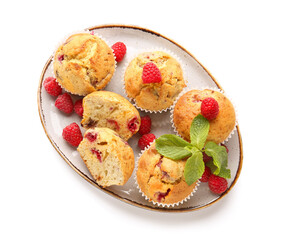 Plate with tasty raspberry muffins on white background