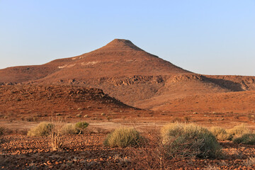 stunning red landscape in the semi desert of namibia, blue sky